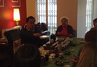 Demonstrating how one would pry open a Pu Erh tea cake