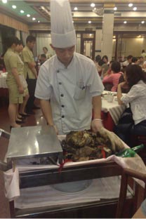 A Lou Wai Lou restaurant chef revealing the Prosperity Chicken!