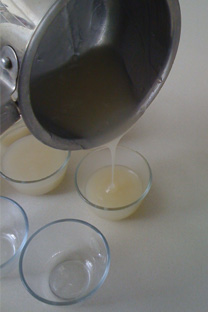 Pouring the thickened mung bean jelly mixture to little ramekins.  Chill in fridge for an hour or two.