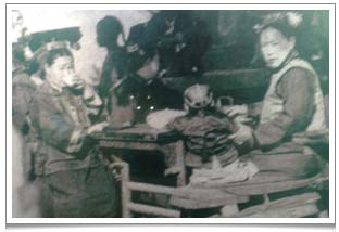 Women from the Qing Dynasty, likely to be from a very well to do family, enjoying tea at a teahouse. Note that the chair is rather high compared to the table.  This is typical of Chinese furniture. We use such traditional antique furniture at Teanamu Chaya Teahouse.